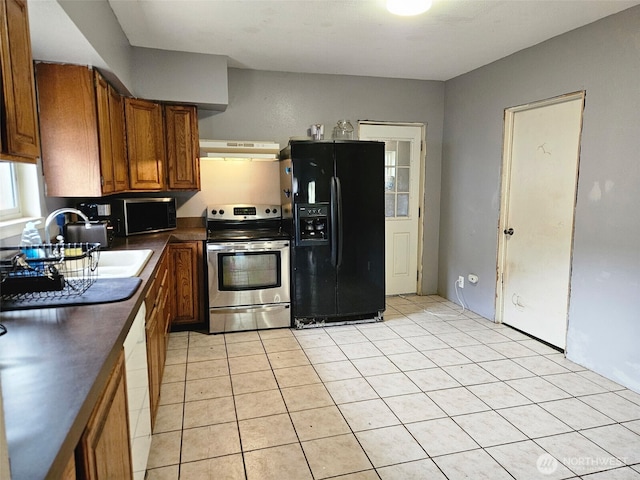 906 SW Mayer, Winlock, WA 98596 - kitchen featuring stainless steel range with electric stovetop, black refrigerator with ice dispenser, under cabinet range hood, dark countertops, and brown cabinetry