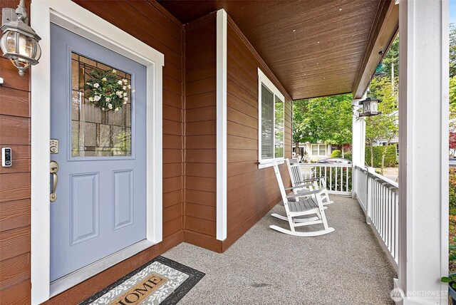 doorway to property with covered porch