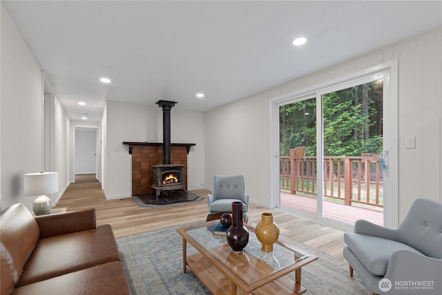 1071 Red Valley Ln, Maple Falls, WA 98266 - living area featuring wood finished floors, a wood stove, and recessed lighting