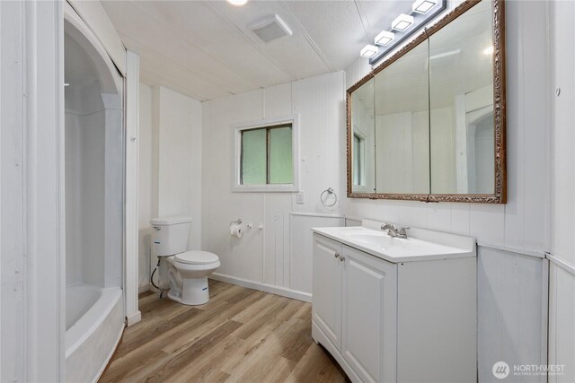 1071 Red Valley Ln, Maple Falls, WA 98266 - full bath featuring toilet, wood finished floors, vanity, a shower, and a tub