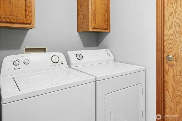 laundry room featuring cabinet space and washing machine and dryer