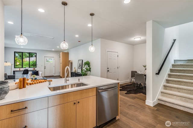 22513 Clearland Ln SE, Yelm, WA 98597 - kitchen featuring dishwasher, a sink, open floor plan, dark wood-style flooring, and light countertops