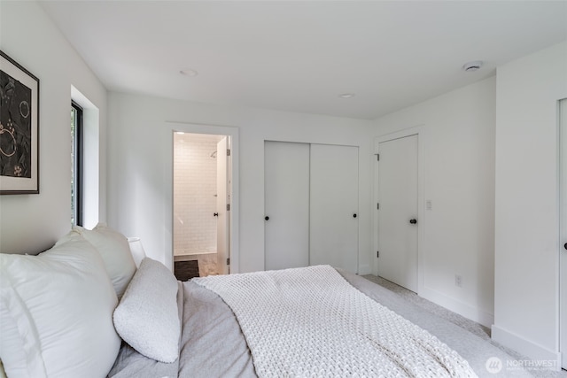 22513 Clearland Ln SE, Yelm, WA 98597 - bedroom with ensuite bathroom, baseboards, and a closet