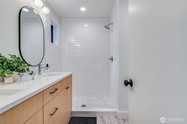 22513 Clearland Ln SE, Yelm, WA 98597 - bathroom featuring a tile shower, double vanity, and recessed lighting