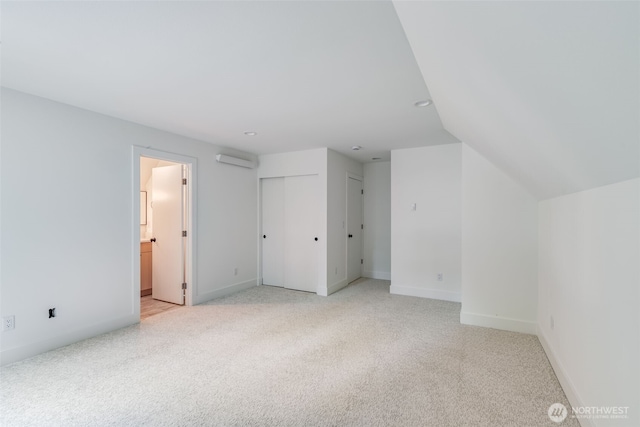 22513 Clearland Ln SE, Yelm, WA 98597 - bonus room featuring light colored carpet, baseboards, recessed lighting, an AC wall unit, and lofted ceiling