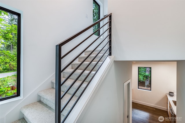 22513 Clearland Ln SE, Yelm, WA 98597 - stairs featuring wood finished floors and baseboards