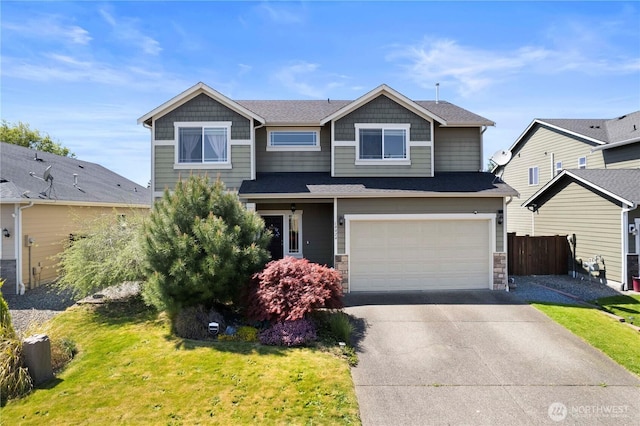 19424 E 26th Avenue Ct E, Spanaway, WA 98387 - craftsman house featuring driveway, a garage, and stone siding