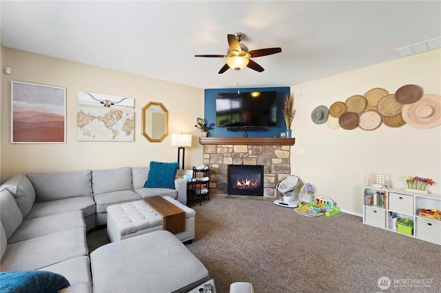 19424 E 26th Avenue Ct E, Spanaway, WA 98387 - living room featuring ceiling fan, a fireplace, carpet floors, and baseboards