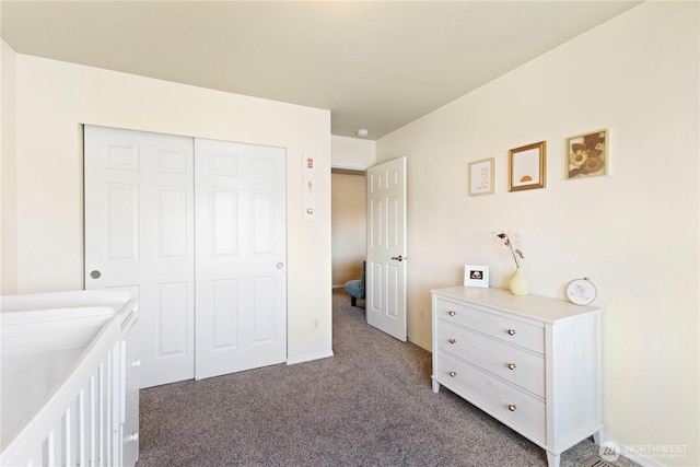 19424 E 26th Avenue Ct E, Spanaway, WA 98387 - bedroom featuring dark colored carpet, a closet, and baseboards