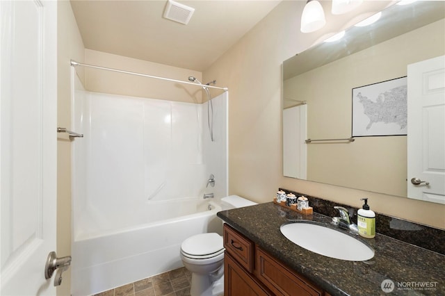 19424 E 26th Avenue Ct E, Spanaway, WA 98387 - bathroom with toilet, vanity, and bathtub / shower combination