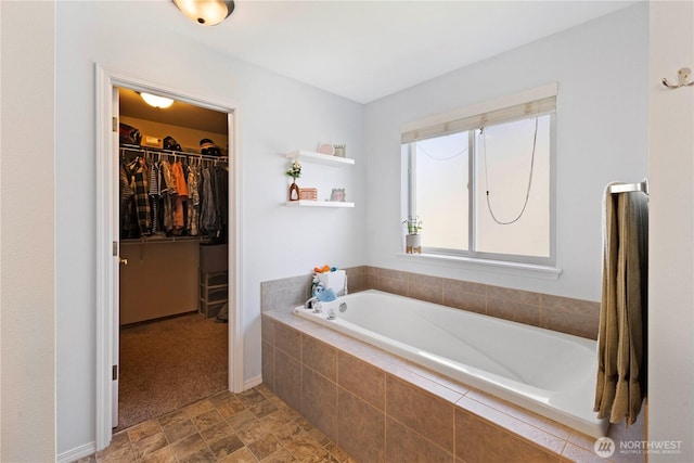 19424 E 26th Avenue Ct E, Spanaway, WA 98387 - bathroom with a bath and a spacious closet