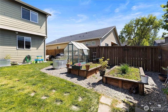 19424 E 26th Avenue Ct E, Spanaway, WA 98387 - rear view of property with a garden, an exterior structure, and an outbuilding