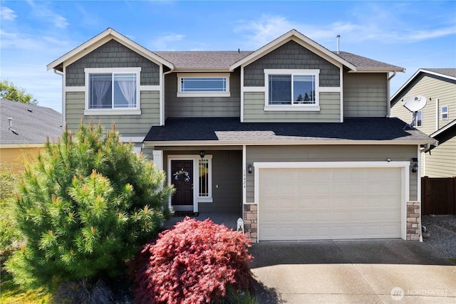19424 E 26th Avenue Ct E, Spanaway, WA 98387 - craftsman house featuring stone siding, concrete driveway, a garage, and a shingled roof
