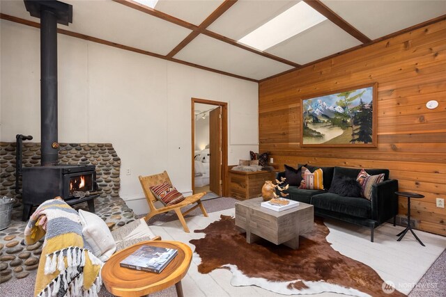 15790 Agatewood Rd NE, Bainbridge Island, WA 98110 - living area with a wood stove, wood walls, and lofted ceiling