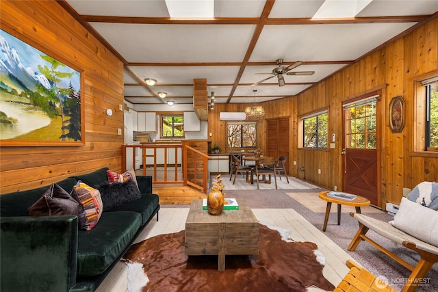 15790 Agatewood Rd NE, Bainbridge Island, WA 98110 - living room featuring wooden walls, a ceiling fan, beam ceiling, and a chandelier