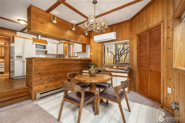 15790 Agatewood Rd NE, Bainbridge Island, WA 98110 - dining room featuring a baseboard radiator, an AC wall unit, wooden walls, a chandelier, and light carpet