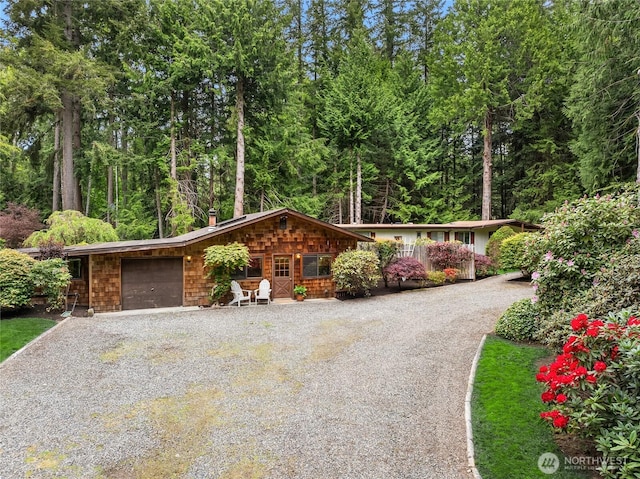 15790 Agatewood Rd NE, Bainbridge Island, WA 98110 - view of front facade with gravel driveway and a garage