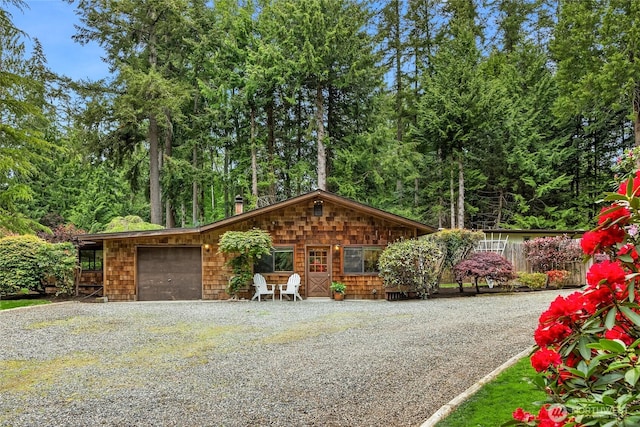 15790 Agatewood Rd NE, Bainbridge Island, WA 98110 - view of front facade featuring driveway and an attached garage