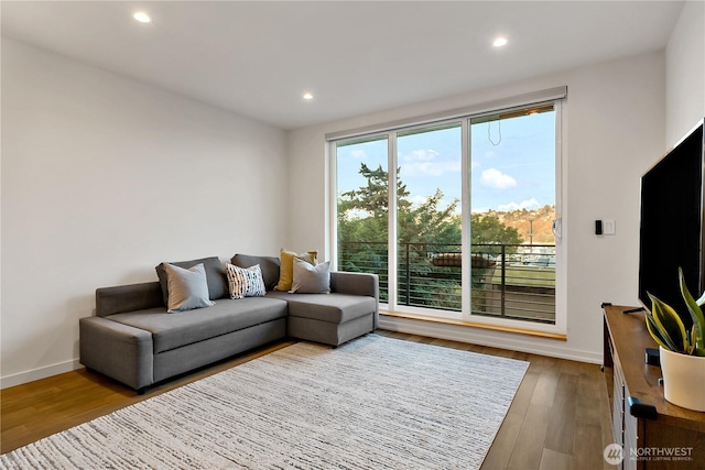 2273 14th Ave W, Seattle, WA 98119 - living area with wood finished floors, recessed lighting, and baseboards