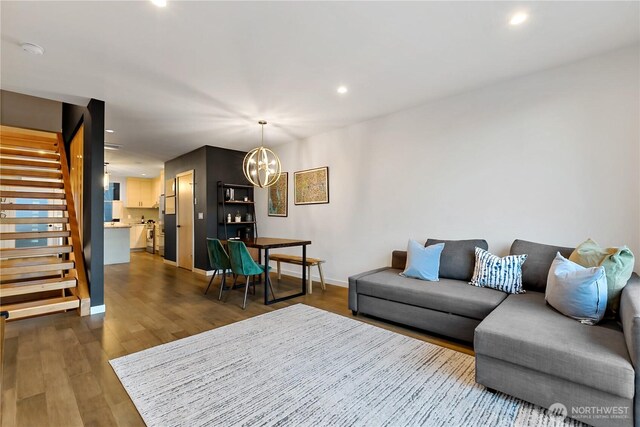 2273 14th Ave W, Seattle, WA 98119 - living area with a chandelier, stairway, baseboards, dark wood-type flooring, and recessed lighting