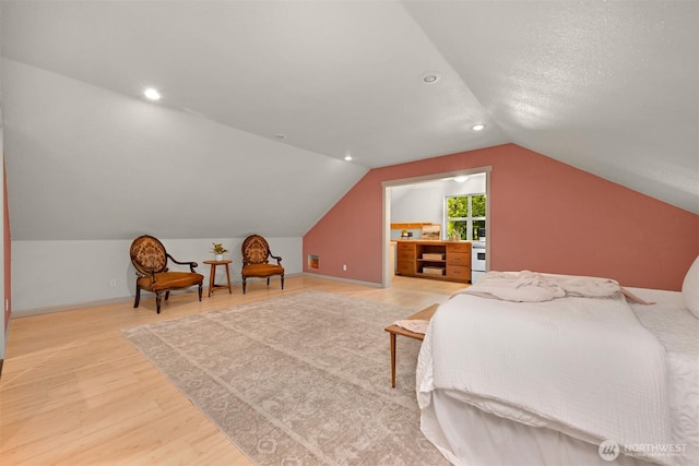 9591 W 34th Cres, Blaine, WA 98230 - bedroom with light wood finished floors, vaulted ceiling, baseboards, and recessed lighting