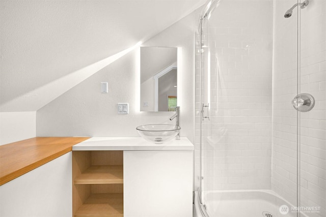 9591 W 34th Cres, Blaine, WA 98230 - full bathroom featuring vanity, vaulted ceiling, and shower / bath combination with glass door
