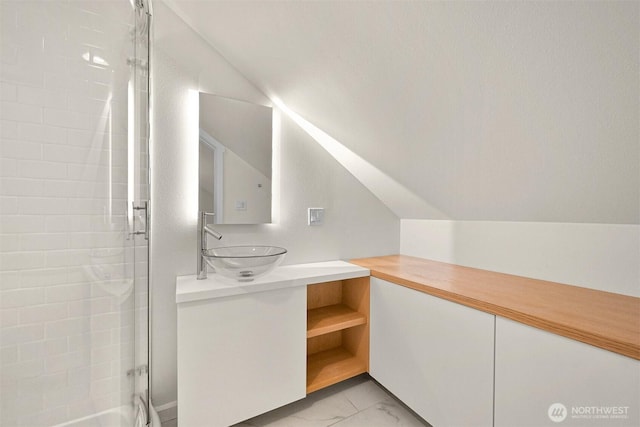 9591 W 34th Cres, Blaine, WA 98230 - bathroom with marble finish flooring, vanity, and vaulted ceiling