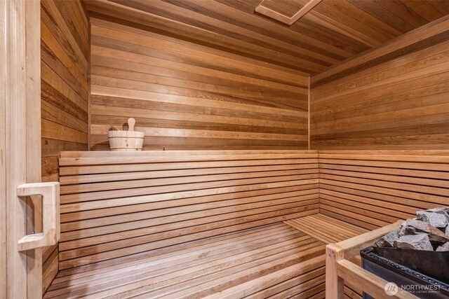 relaxing sauna / steam room with wooden walls and wood ceiling