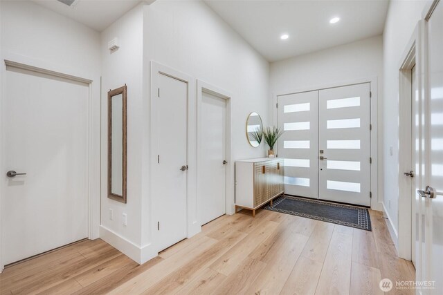 entryway featuring light wood-style floors and recessed lighting