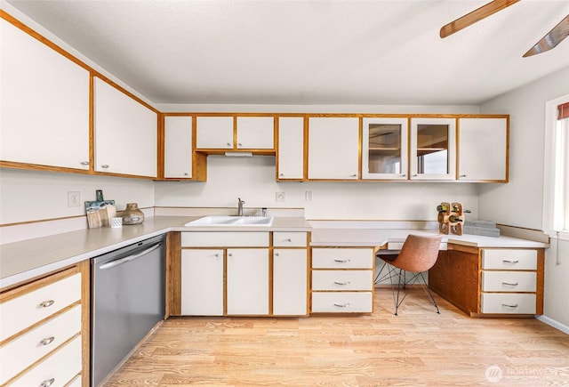 2619 Rucker Ave Unit 4, Everett, WA 98201 - kitchen with a sink, stainless steel dishwasher, light wood-style flooring, and light countertops