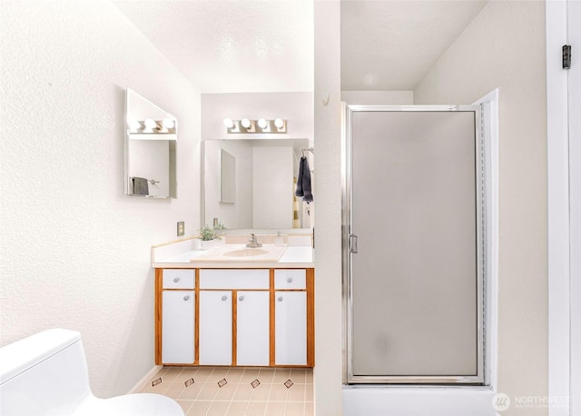 2619 Rucker Ave Unit 4, Everett, WA 98201 - bathroom featuring toilet, a stall shower, vanity, and tile patterned flooring