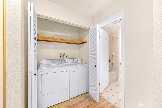 2619 Rucker Ave Unit 4, Everett, WA 98201 - laundry room with washing machine and clothes dryer and light wood finished floors