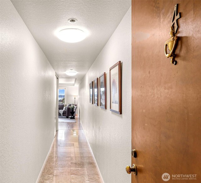 2619 Rucker Ave Unit 4, Everett, WA 98201 - hallway with baseboards, a textured wall, and a textured ceiling