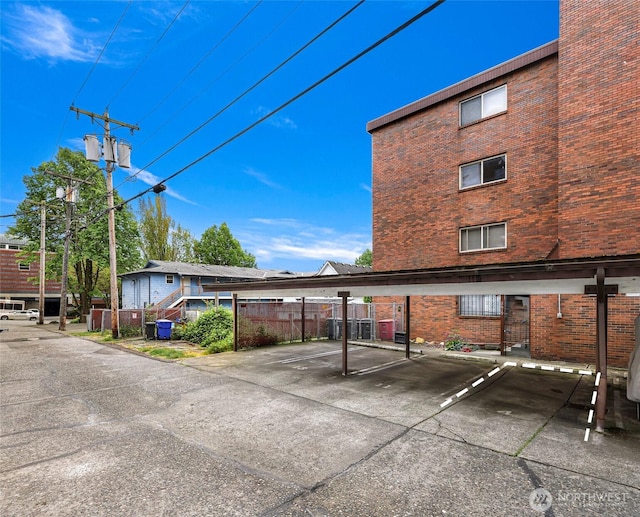 2619 Rucker Ave Unit 4, Everett, WA 98201 - covered parking lot featuring fence