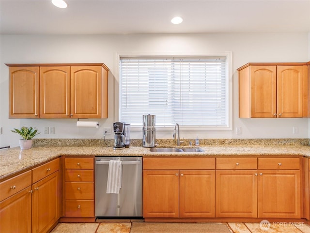 kitchen with dishwasher, a sink, light stone counters, and recessed lighting