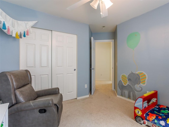 sitting room with light carpet, ceiling fan, and baseboards