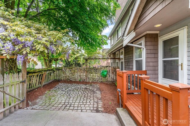 view of patio / terrace with a fenced backyard and a deck