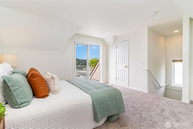 bedroom featuring access to exterior, lofted ceiling, baseboards, and carpet