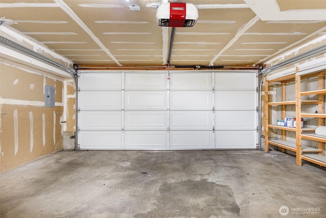 garage featuring a garage door opener and electric panel