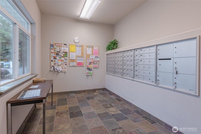 view of home's community featuring mail area