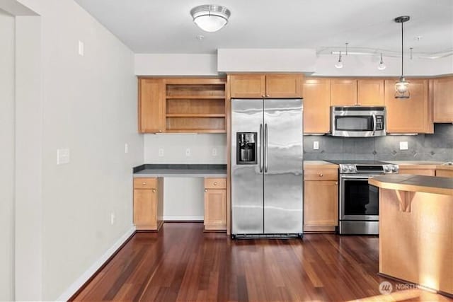 13426 97th Ave E Unit 204, Puyallup, WA 98373 - kitchen with stainless steel appliances, dark wood-style flooring, decorative backsplash, pendant lighting, and baseboards