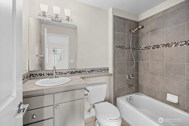 13426 97th Ave E Unit 204, Puyallup, WA 98373 - full bathroom with toilet, shower / bathtub combination, vanity, and tile patterned flooring