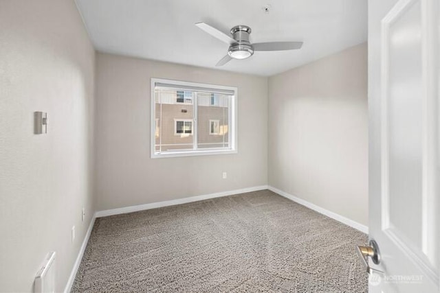 13426 97th Ave E Unit 204, Puyallup, WA 98373 - spare room featuring a ceiling fan, carpet, and baseboards