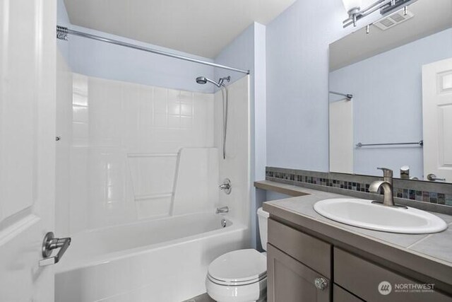 13426 97th Ave E Unit 204, Puyallup, WA 98373 - bathroom with toilet, shower / tub combination, and vanity