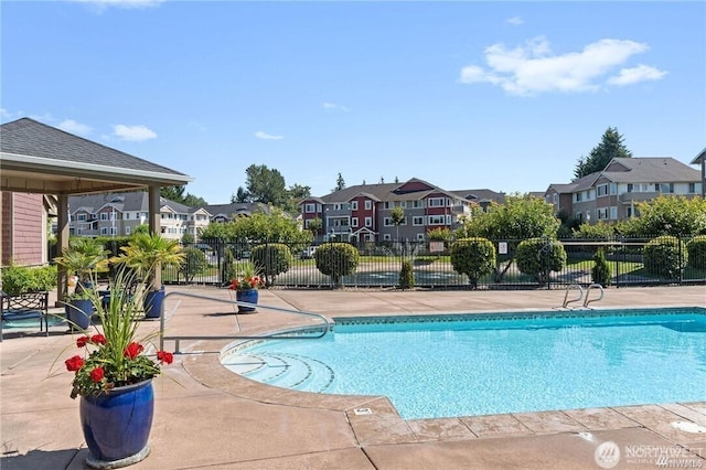 13426 97th Ave E Unit 204, Puyallup, WA 98373 - community pool featuring a residential view, fence, and a patio area