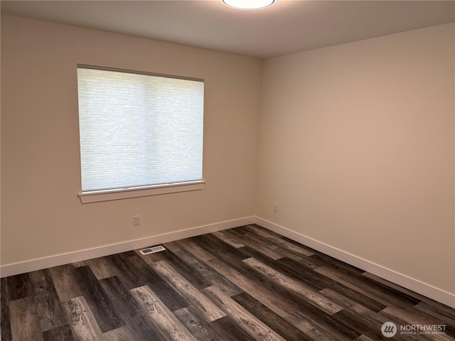 25117 235th Ct SE, Maple Valley, WA 98038 - empty room with dark wood-type flooring and baseboards