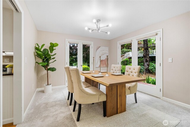 21016 NE 33rd Pl, Sammamish, WA 98074 - dining area featuring light colored carpet, baseboards, and a chandelier