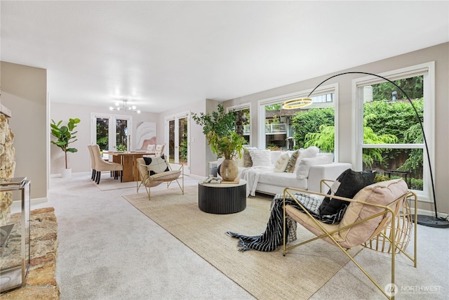 21016 NE 33rd Pl, Sammamish, WA 98074 - living area featuring carpet floors, baseboards, french doors, and a chandelier