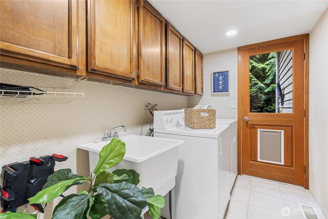 21016 NE 33rd Pl, Sammamish, WA 98074 - laundry room with independent washer and dryer, cabinet space, light tile patterned floors, and recessed lighting