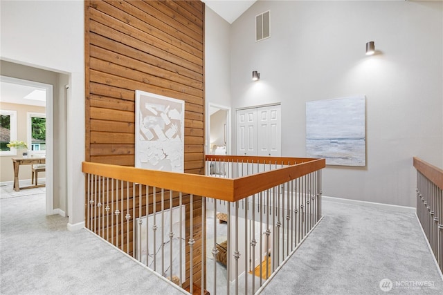 21016 NE 33rd Pl, Sammamish, WA 98074 - corridor featuring carpet, high vaulted ceiling, and baseboards